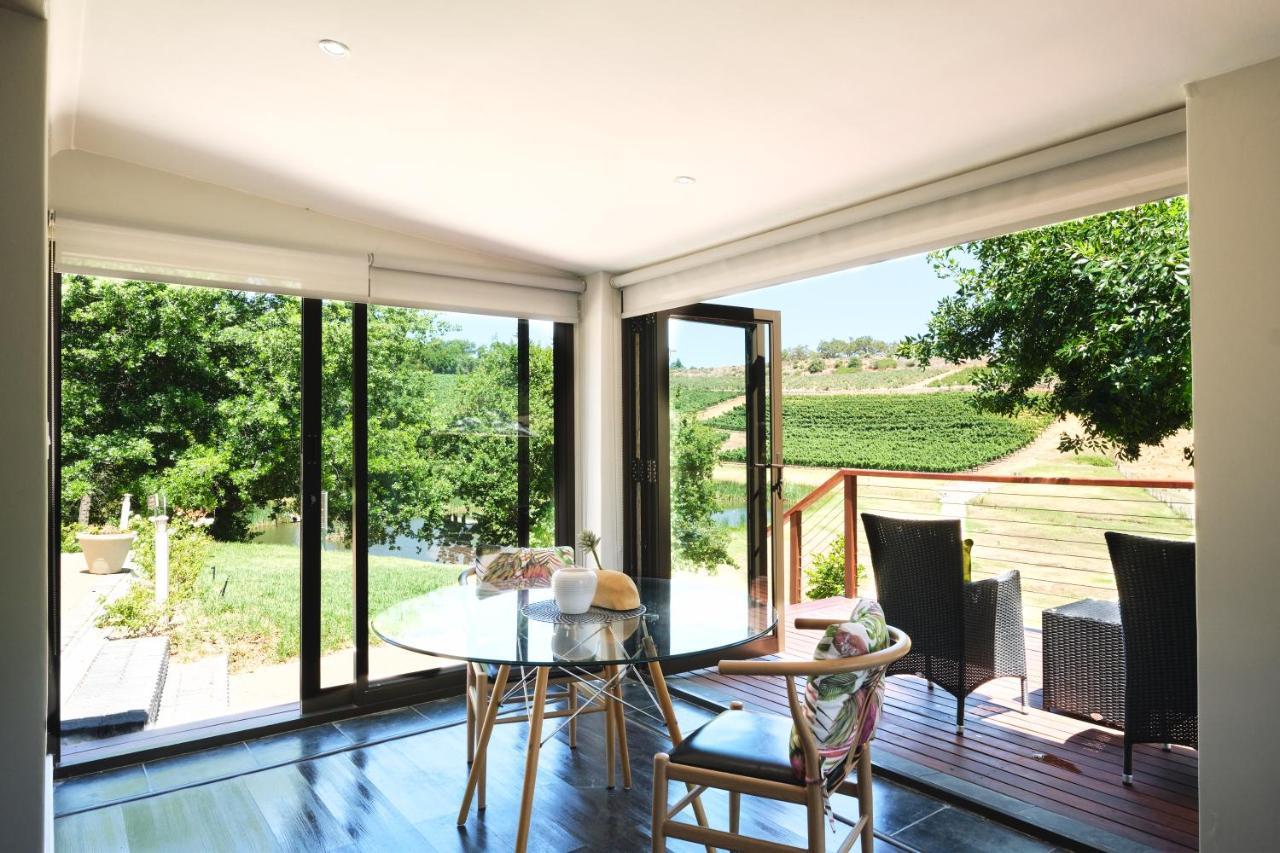 Alluvia Boutique Winery & Luxury Accommodation Stellenbosch Bagian luar foto A room with a view of the vineyards