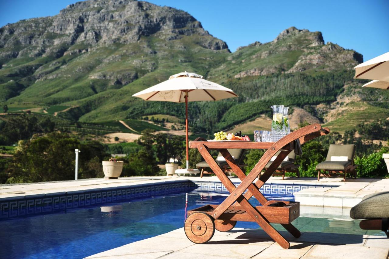 Alluvia Boutique Winery & Luxury Accommodation Stellenbosch Bagian luar foto A poolside bar cart
